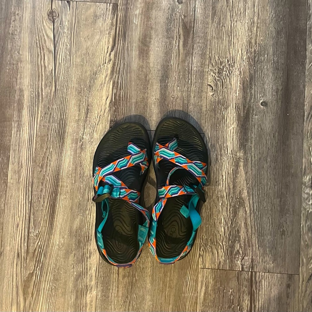Blue, orange, and purple women’s Chacos